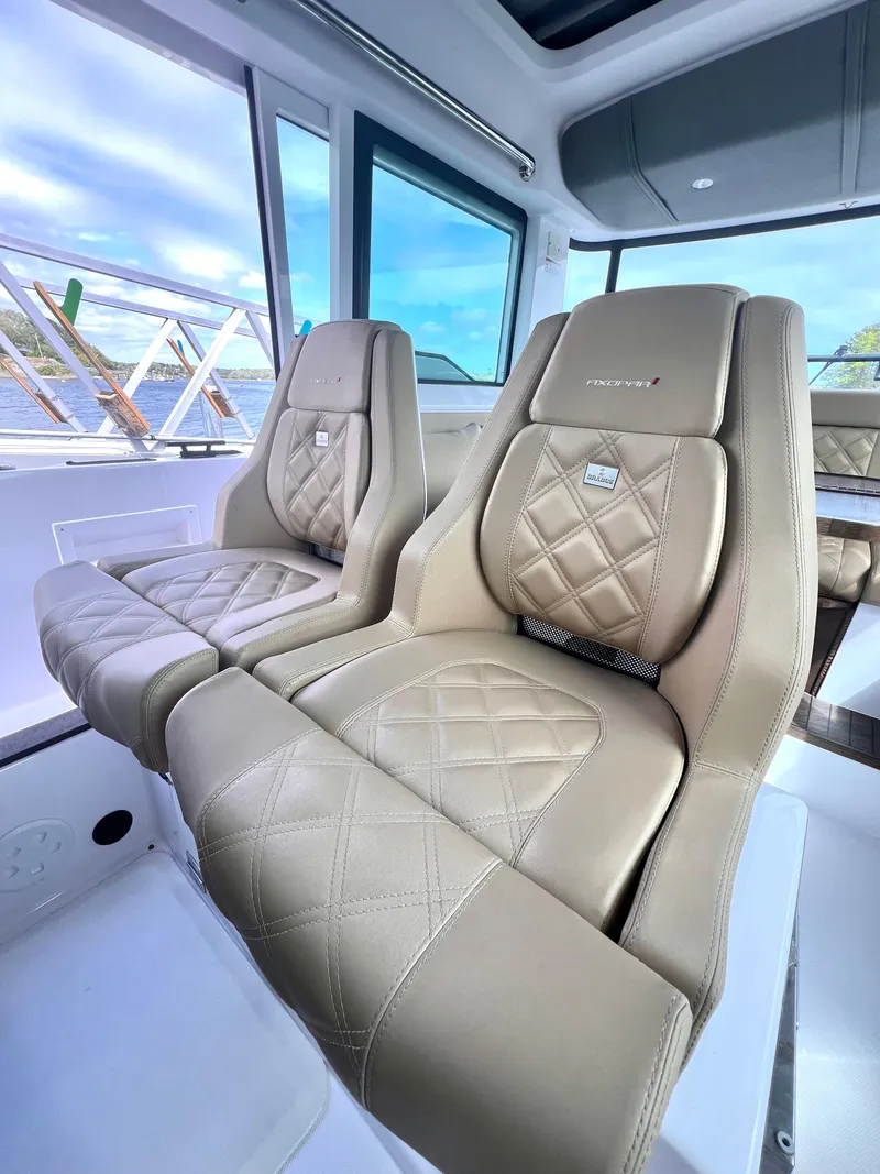 Slide: The Image of Luxurious interior seating of 2021 Axopar 37 XC Cross Cabin with quilted leather design. - 6