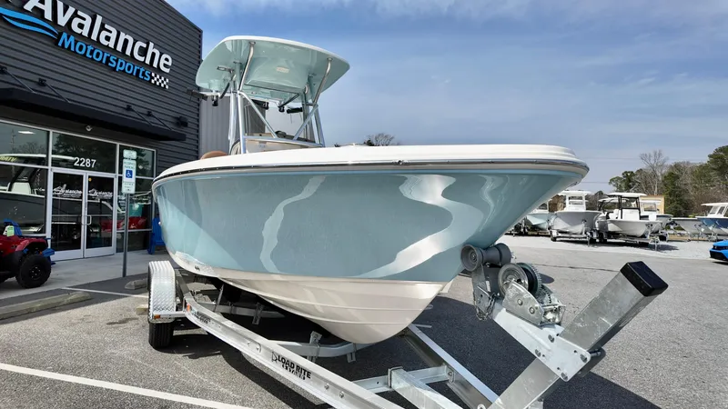 Slide: The Image of 2025 Pioneer 220 Bay Sport boat on trailer at Avalanche Motorsports. - 2