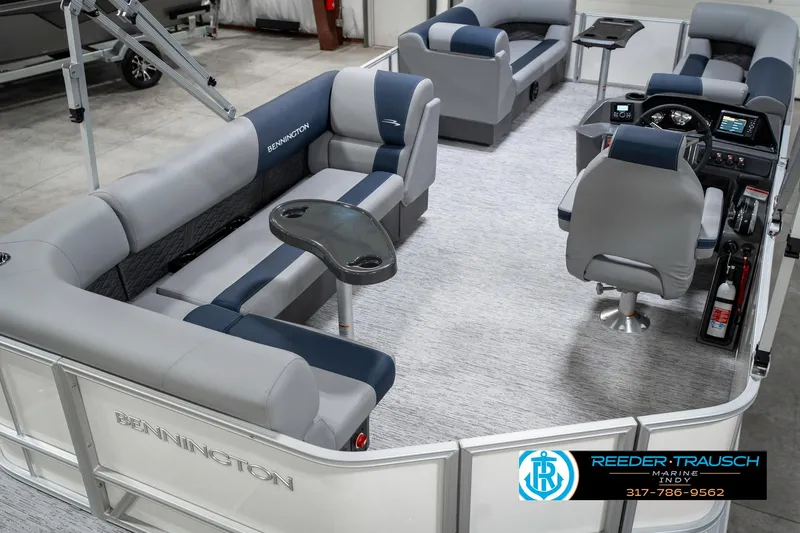 Slide: The Image of 2025 Bennington 22 SLS pontoon boat interior with plush seating and modern helm. - 13
