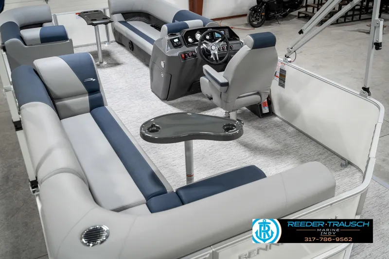 Slide: The Image of Interior of 2025 Bennington 22 SLS pontoon boat with plush seating and modern helm. - 14