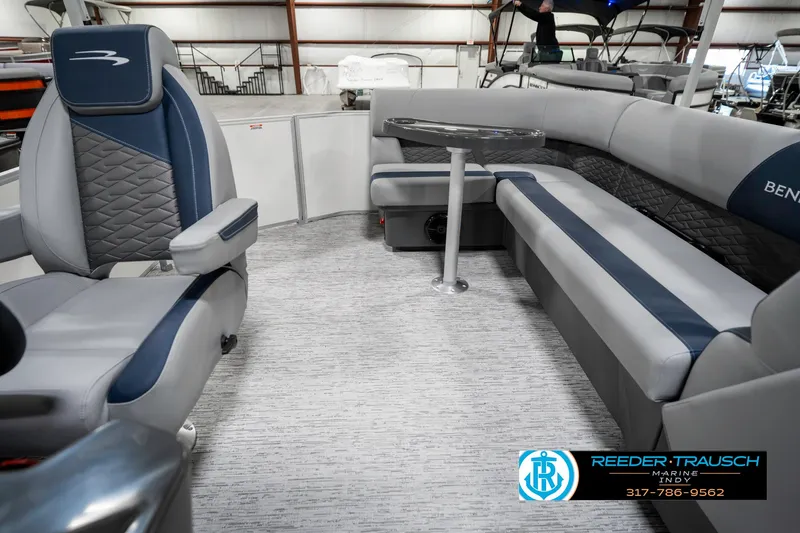 Slide: The Image of 2025 Bennington 22 SLS boat interior with gray and blue seating, modern design. - 16