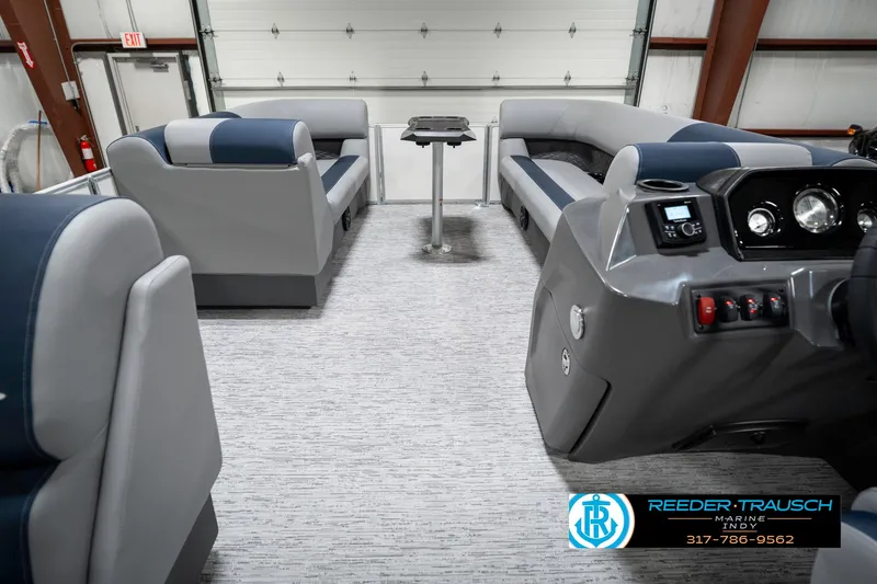 Slide: The Image of Interior of a 2025 Bennington 22 SLS pontoon boat with modern seating and controls. - 19