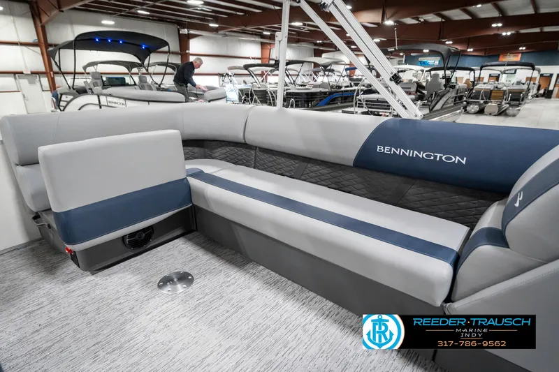 Slide: The Image of 2025 Bennington 22 SLS pontoon boat interior with gray and blue seating. - 27