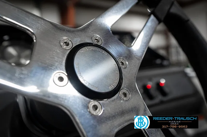 Slide: The Image of Close-up of 2025 Bennington 22 SLS steering wheel with metallic finish. - 32