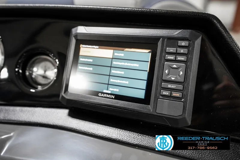 Slide: The Image of Garmin display on 2025 Bennington 22 SLS boat dashboard, featuring navigation controls. - 36