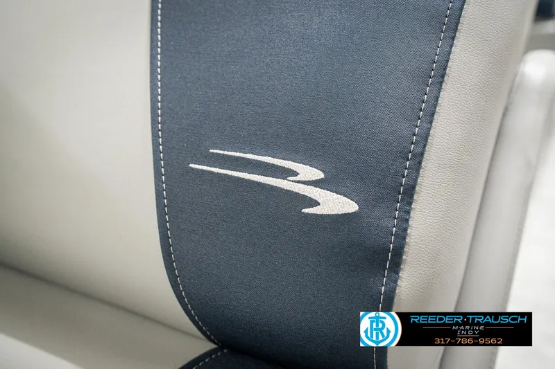 Slide: The Image of 2025 Bennington 22 SLS boat seat with logo, featuring blue and gray upholstery. - 42