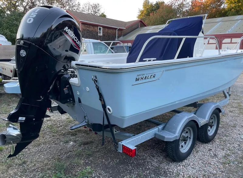 Slide: The Image of 2020 Boston Whaler 190 Montauk boat on trailer with Mercury outboard motor. - 6