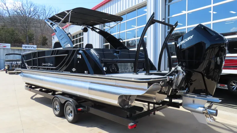 Slide: The Image of 2025 South Bay 25 Sport CR9 3 pontoon boat with Mercury engine on trailer. - 2