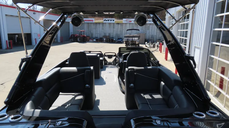 Slide: The Image of Interior view of 2025 South Bay 25 Sport CR9 3 boat with sleek seating. - 4