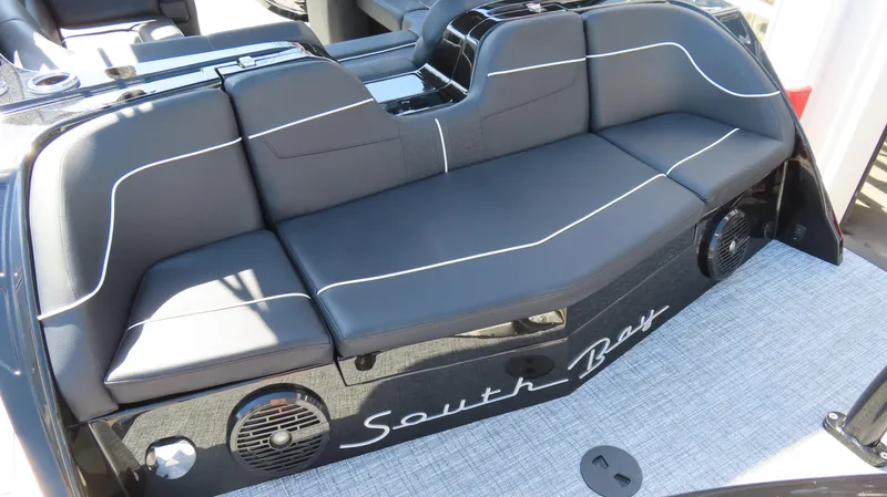 Slide: The Image of 2025 South Bay 25 Sport CR9 3 boat seating with sleek black upholstery and stylish design. - 9