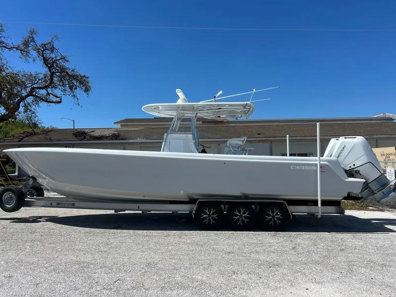 Slide: The Image of 2024 Contender 35 ST boat on trailer, side view, outdoors. - 1