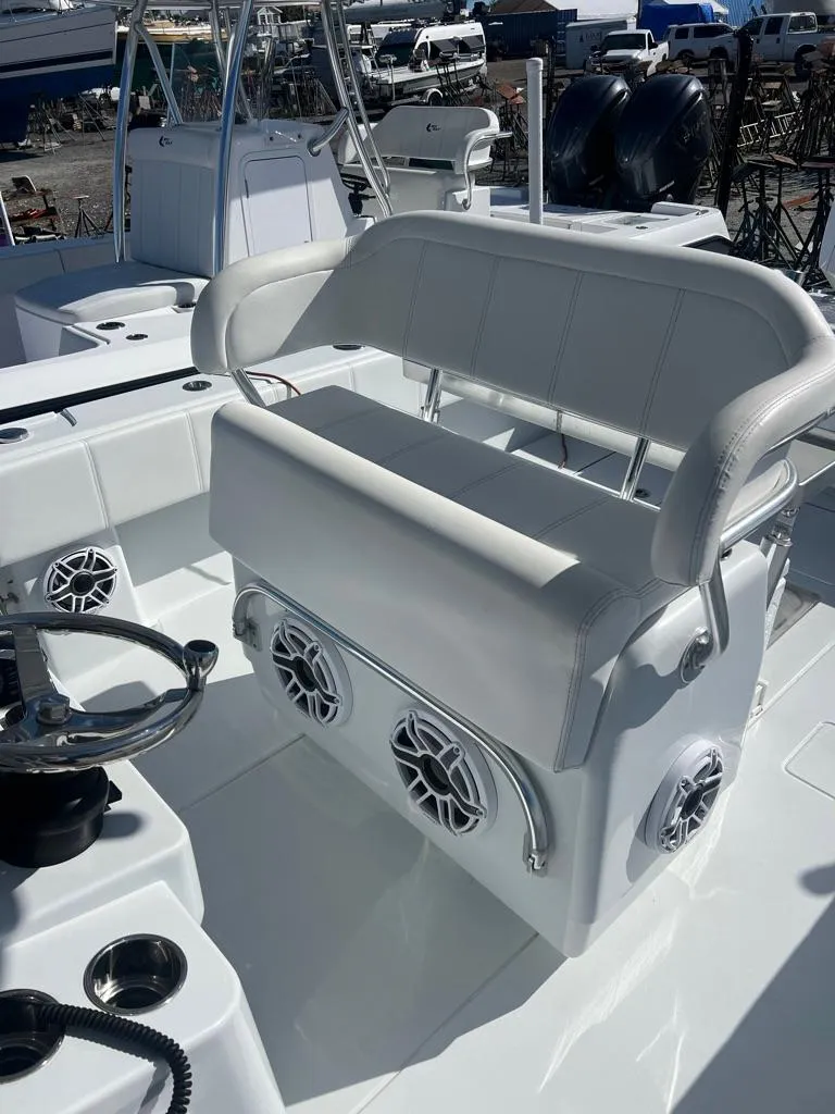 Slide: The Image of 2024 Contender 35 ST boat interior with white seating and modern controls. - 5