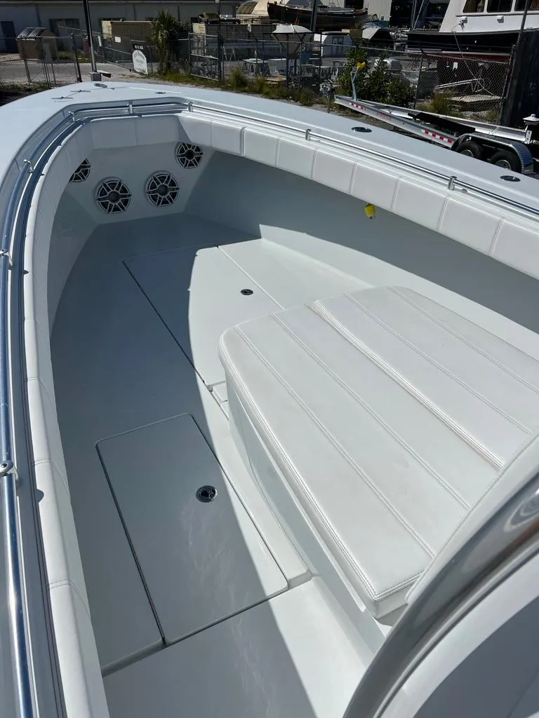 Slide: The Image of 2024 Contender 35 ST boat interior with white seating and speakers. - 8