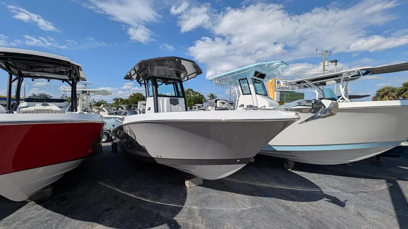 The Image of 2025 Wellcraft 243 Fisherman boat displayed outdoors under a clear blue sky. - 0
