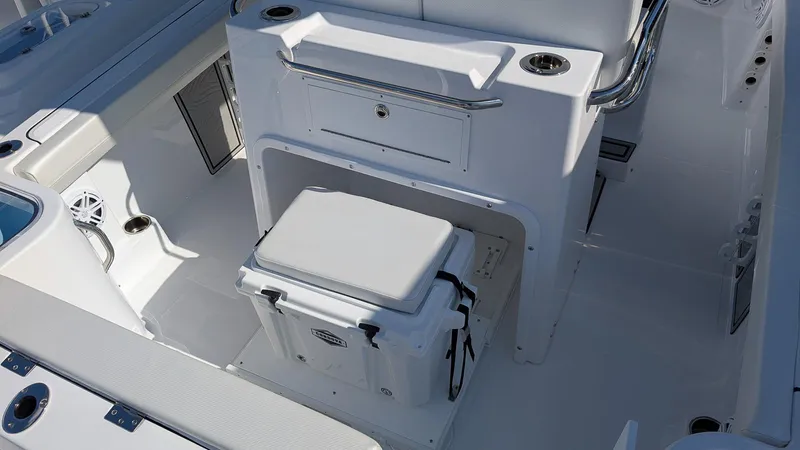 Slide: The Image of 2025 Wellcraft 243 Fisherman boat interior with seating and storage. - 11