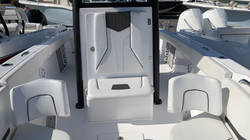 Slide: The Image of 2025 Wellcraft 243 Fisherman boat interior with white seating and modern design. - 17