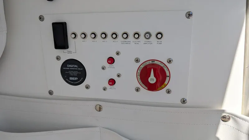 Slide: The Image of Control panel of 2025 Wellcraft 243 Fisherman boat with switches and dials. - 19