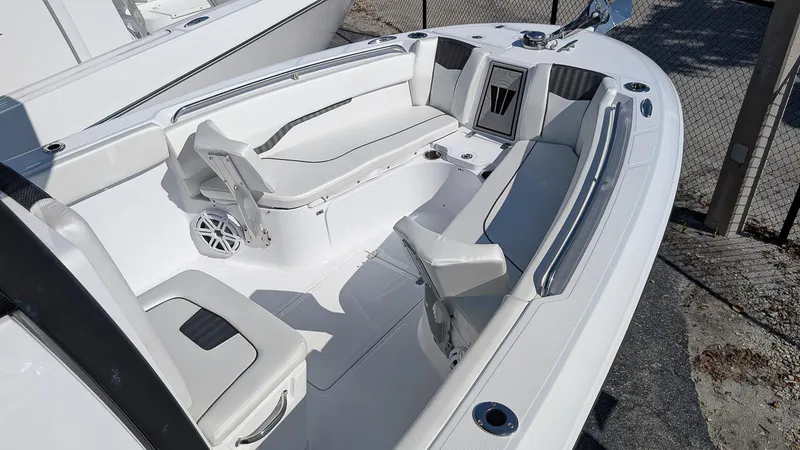 Slide: The Image of 2025 Wellcraft 243 Fisherman boat interior with white seating and modern design. - 9