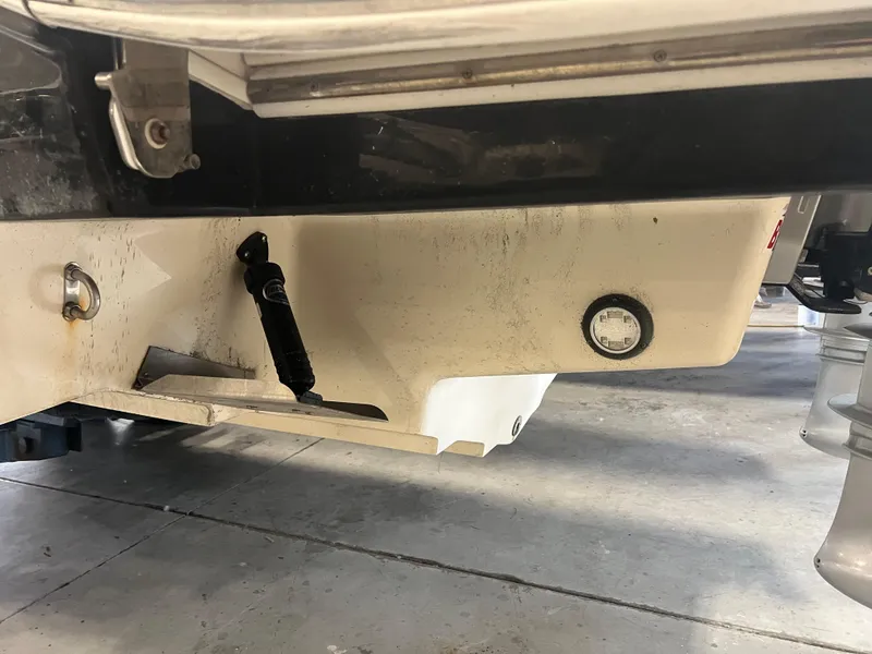 Slide: The Image of 2020 Sea Ray SDX 290 Outboard boat hull detail in a garage setting. - 4