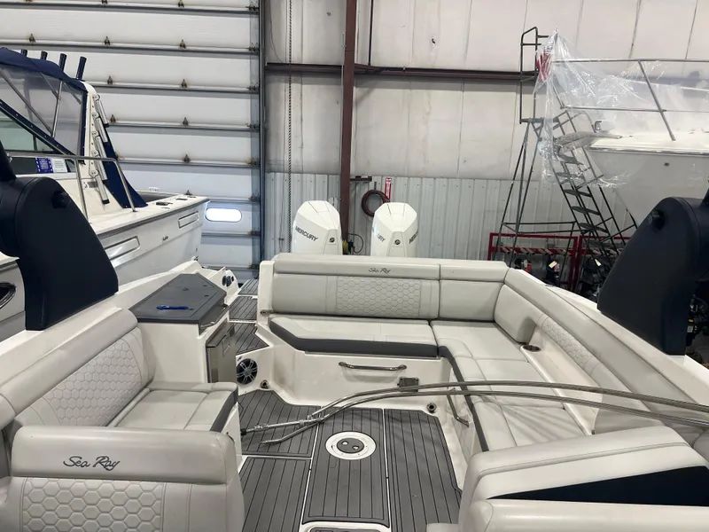 Slide: The Image of 2020 Sea Ray SDX 290 Outboard boat interior in a storage facility. - 5