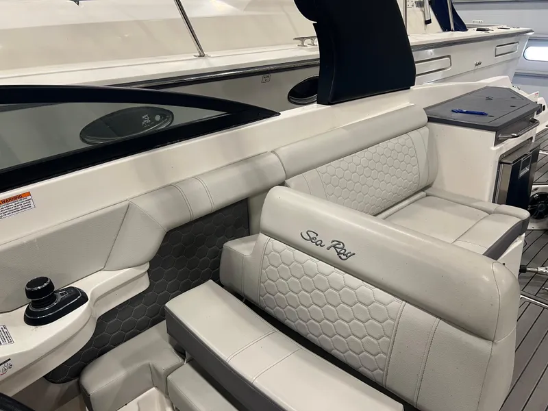 Slide: The Image of 2020 Sea Ray SDX 290 Outboard interior with luxurious seating and modern design. - 7