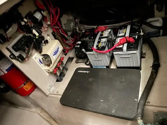Slide: The Image of Engine compartment of 2005 Sea Ray 420 Sedan Bridge with batteries and wiring. - 11