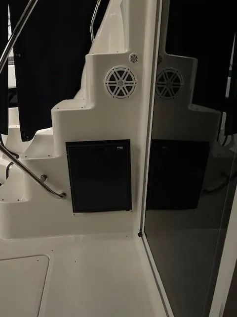 Slide: The Image of 2005 Sea Ray 420 Sedan Bridge interior with speaker and railing details. - 15