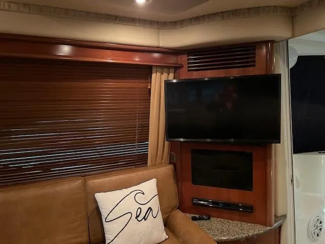 Slide: The Image of Interior of 2005 Sea Ray 420 Sedan Bridge with TV and leather seating. - 18