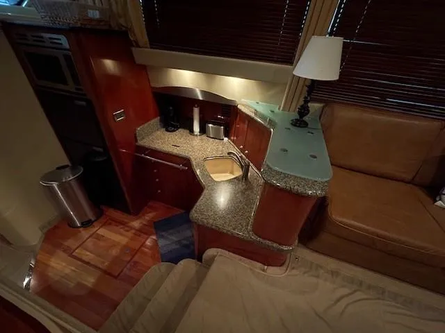 Slide: The Image of Luxurious 2005 Sea Ray 420 Sedan Bridge yacht interior with modern kitchen amenities. - 22