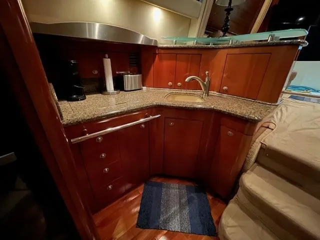 Slide: The Image of Luxurious kitchen area in 2005 Sea Ray 420 Sedan Bridge yacht. - 29
