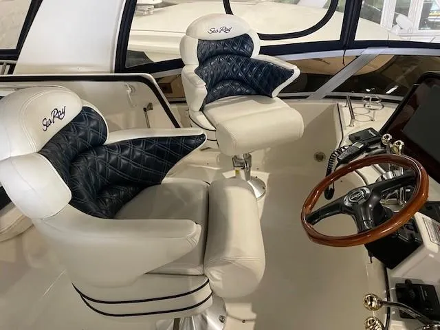 Slide: The Image of Luxurious helm seating on 2005 Sea Ray 420 Sedan Bridge yacht. - 3