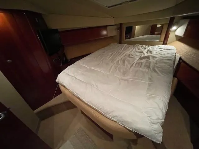 Slide: The Image of Luxurious bedroom interior of 2005 Sea Ray 420 Sedan Bridge yacht. - 35