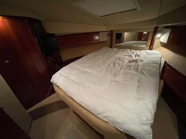Slide: The Image of Luxurious bedroom interior of 2005 Sea Ray 420 Sedan Bridge yacht. - 36