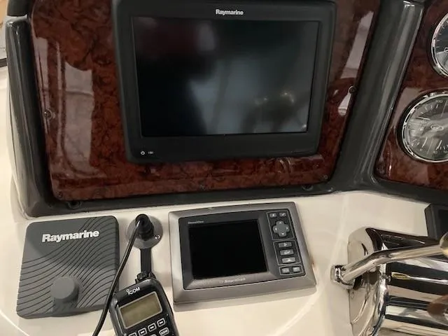 Slide: The Image of Control panel of a 2005 Sea Ray 420 Sedan Bridge with Raymarine electronics. - 44