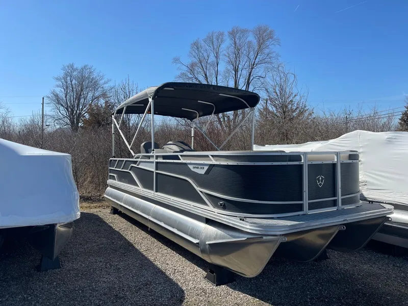 The Image of 2025 Armada Saphir 23CR pontoon boat parked outdoors on gravel. - 1