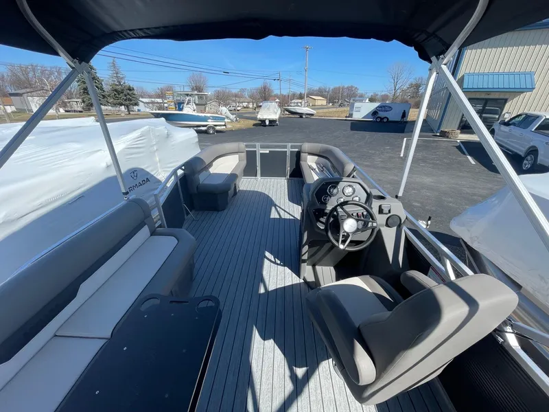 Slide: The Image of 2025 Armada Saphir 23CR pontoon boat interior with seating and steering console. - 10