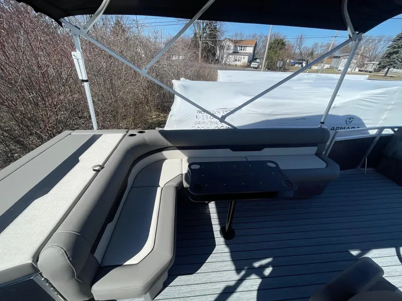 Slide: The Image of Armada Saphir 23CR 2025 boat interior with cushioned seating and table. - 11