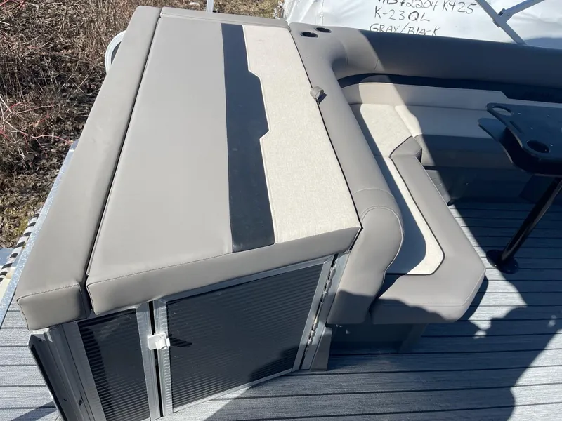 Slide: The Image of 2025 Armada Saphir 23CR boat seating with gray upholstery and storage compartments. - 12