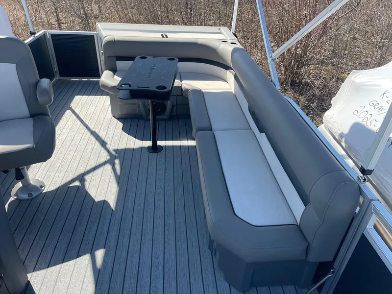 Slide: The Image of 2025 Armada Saphir 23CR boat interior with gray seating and table on deck. - 16