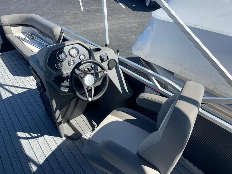Slide: The Image of 2025 Armada Saphir 23CR boat interior with steering wheel and seating. - 17