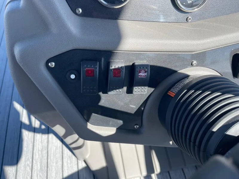 Slide: The Image of Control panel of 2025 Armada Saphir 23CR boat with switches and dials. - 19