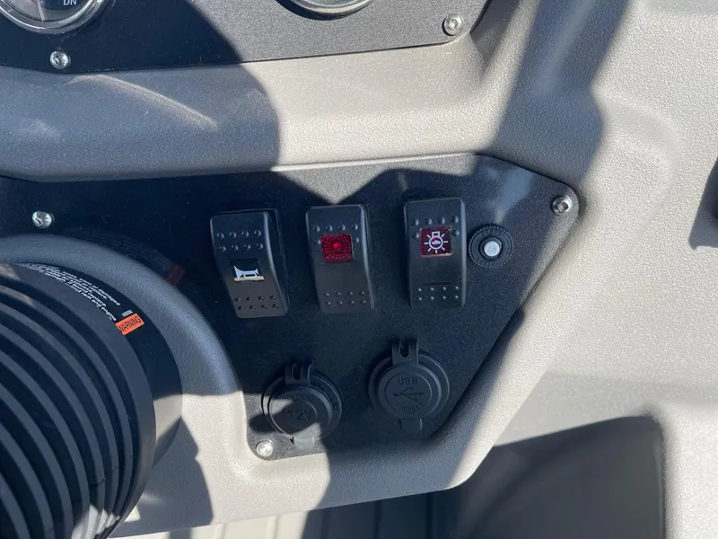 Slide: The Image of Control panel of 2025 Armada Saphir 23CR with switches and dials. - 21