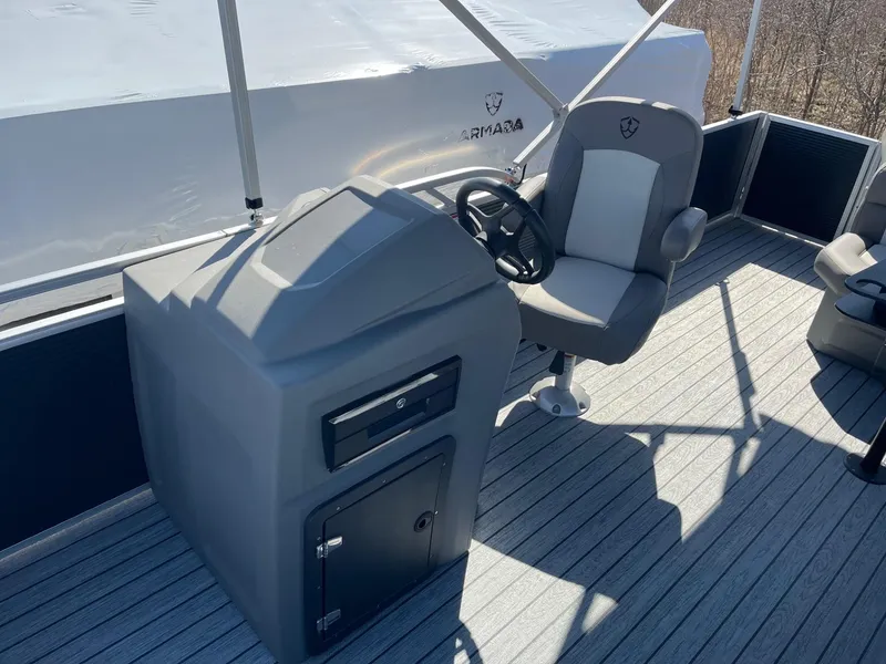 Slide: The Image of 2025 Armada Saphir 23CR boat helm with steering wheel and captain's chair. - 22