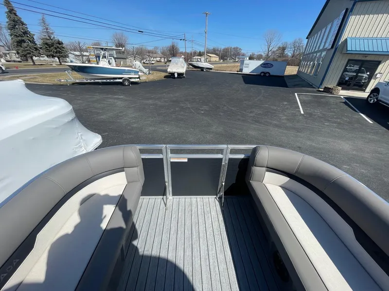 Slide: The Image of 2025 Armada Saphir 23CR pontoon boat interior with gray seating and open deck view. - 27