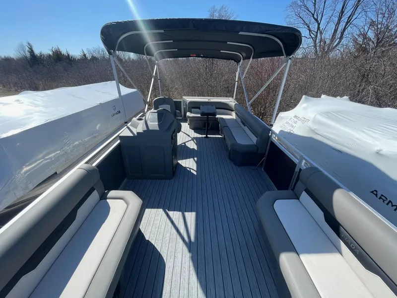 Slide: The Image of 2025 Armada Saphir 23CR pontoon boat with spacious seating and canopy, outdoors. - 32