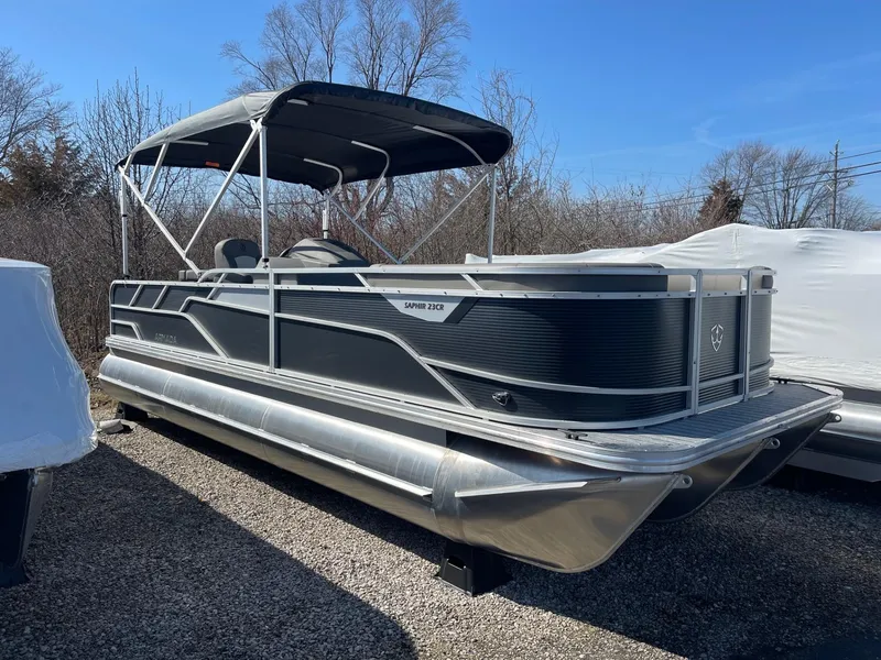 Slide: The Image of 2025 Armada Saphir 23CR pontoon boat with canopy, parked outdoors. - 33