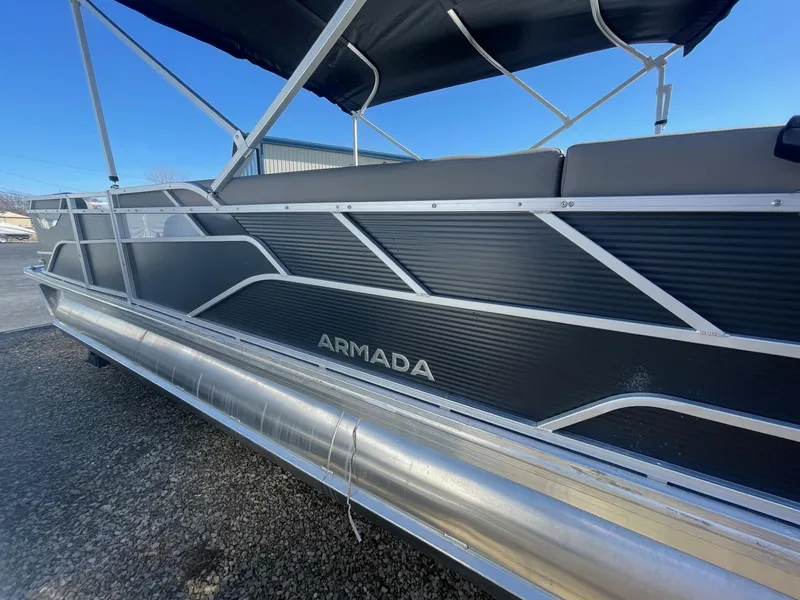 Slide: The Image of 2025 Armada Saphir 23CR pontoon boat with sleek black design and modern features. - 4