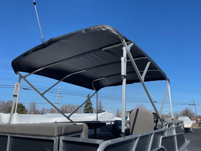 Slide: The Image of 2025 Armada Saphir 23CR pontoon boat with canopy under clear blue sky. - 6