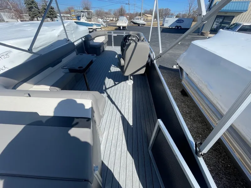 Slide: The Image of 2025 Armada Saphir 23CR boat interior with seating and steering console. - 9