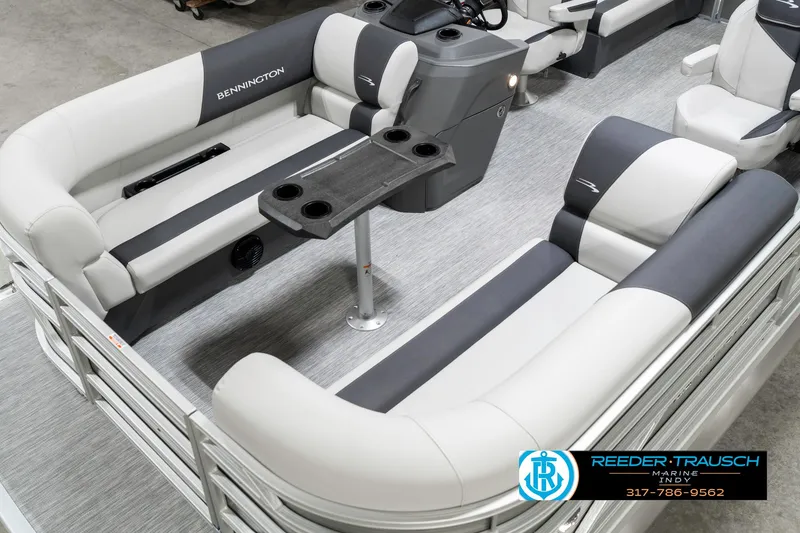 Slide: The Image of 2025 Bennington 20 SSR pontoon boat interior with plush seating and table. - 12